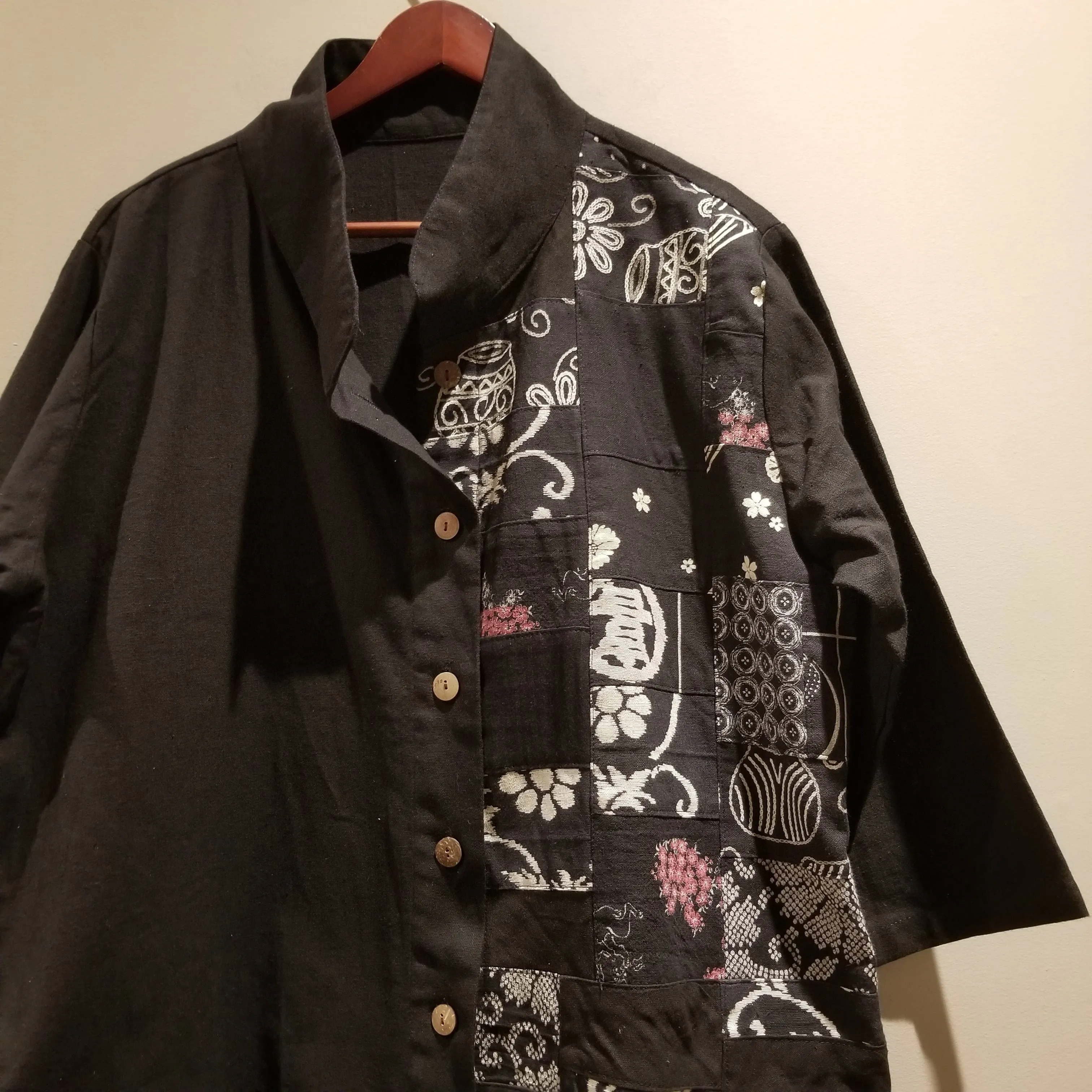 black patchwork button up coat with pockets