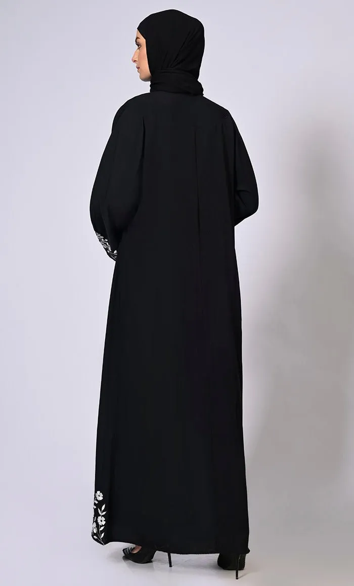 Embroidered Enchantment: Graceful Black Abaya with Delicate Details and Belt