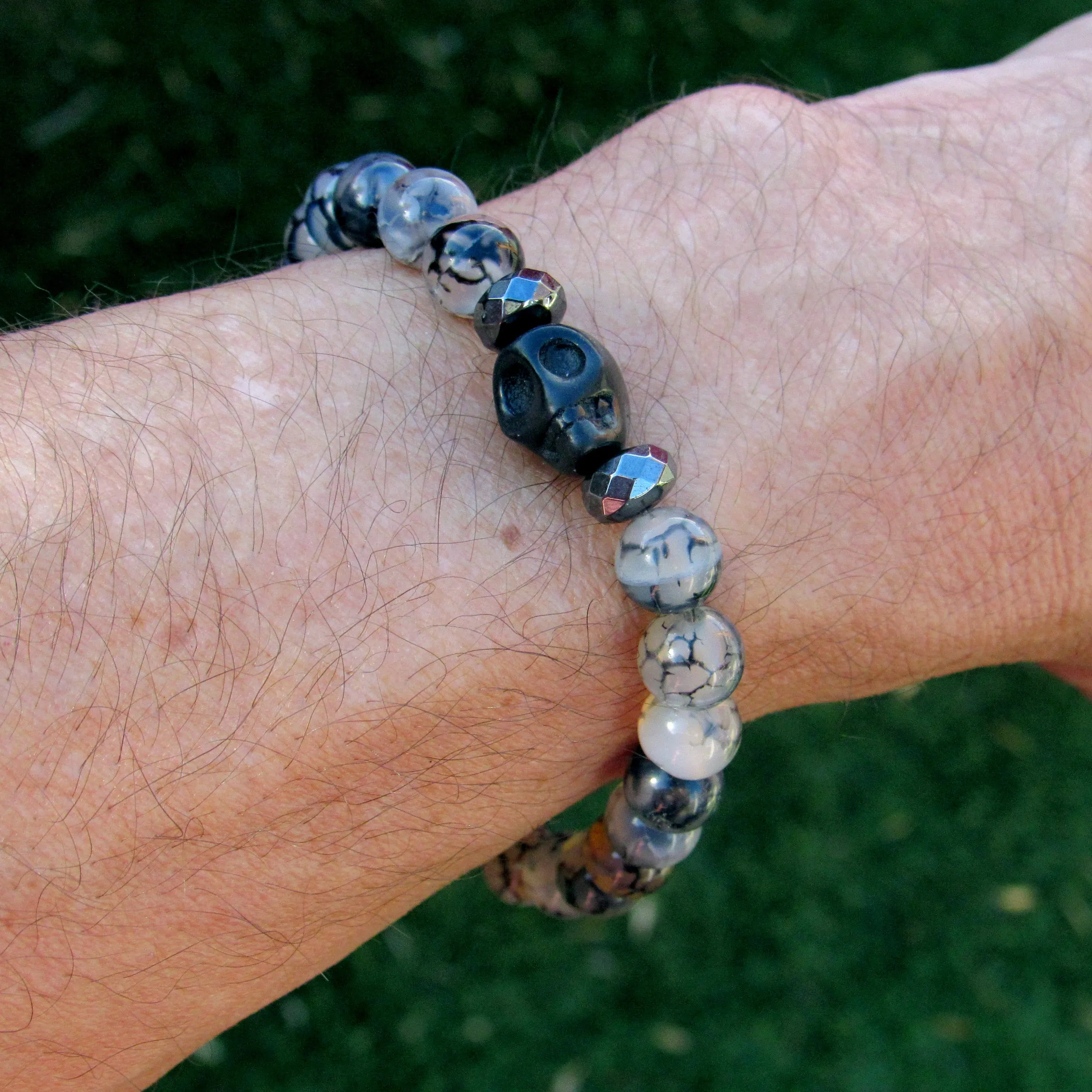 Howlite Skulls, Hematite, Dragon’s Vein Agate gemstone Stretch Bracelet