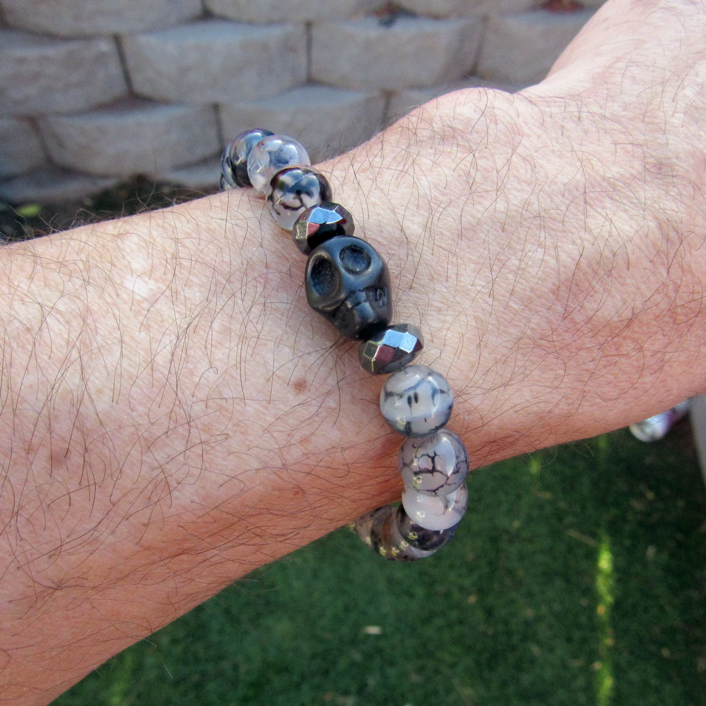 Howlite Skulls, Hematite, Dragon’s Vein Agate gemstone Stretch Bracelet